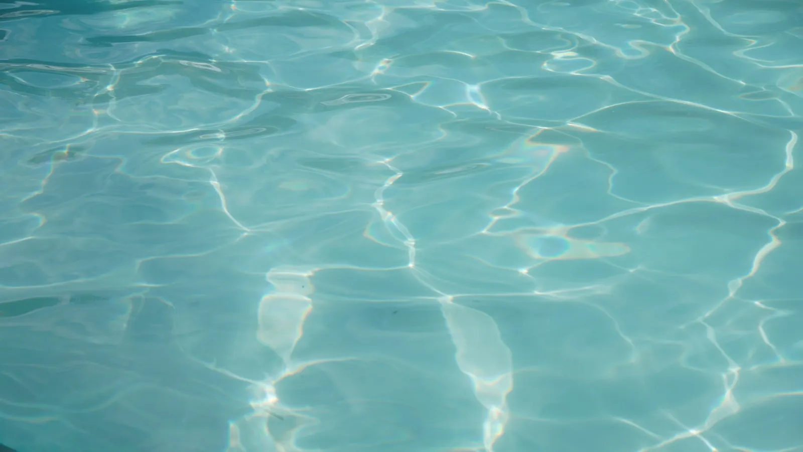 Light patterns on clear blue water